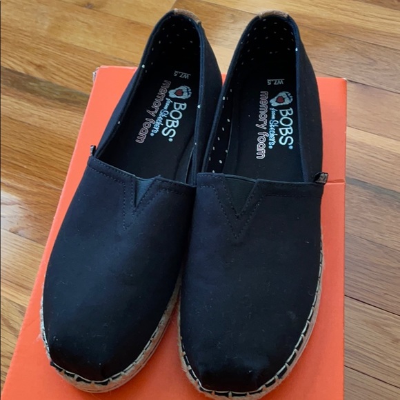 black canvas slip ons